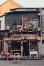 Explore a vintage antique shop with a diverse facade on a bustling urban street, rich in character and history.